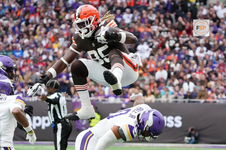 Oct 5, 2025; Tottenham, United Kingdom; Cleveland Browns tight end David Njoku (85) leaps over Minnesota Vikings linebacker Ivan Pace Jr. (0) during the third quarter of an NFL International Series game at Tottenham Hotspur Stadium. Credit: Kirby Lee-Imagn Images