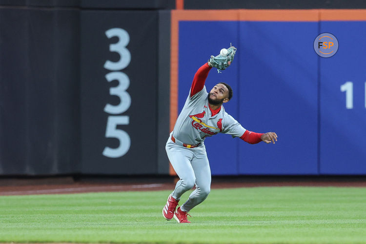 Apr 18, 2025; New York City, New York, USA;  St. Louis Cardinals left fielder Victor Scott II (11) makes a running catch in the first inning against the New York Mets at Citi Field. Credit: Wendell Cruz-Imagn Images