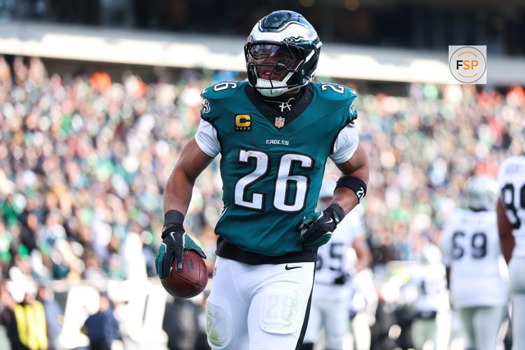 Dec 14, 2025; Philadelphia, Pennsylvania, USA; Philadelphia Eagles running back Saquon Barkley (26) reacts after scoring a touchdown against the Las Vegas Raiders during the second quarter at Lincoln Financial Field. Credit: Bill Streicher-Imagn Images