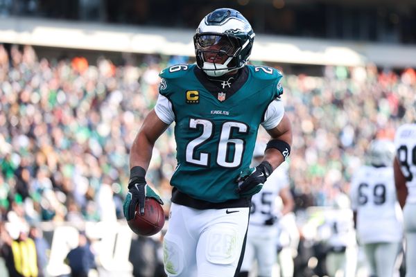 Dec 14, 2025; Philadelphia, Pennsylvania, USA; Philadelphia Eagles running back Saquon Barkley (26) reacts after scoring a touchdown against the Las Vegas Raiders during the second quarter at Lincoln Financial Field. Mandatory Credit: Bill Streicher-Imagn Images
