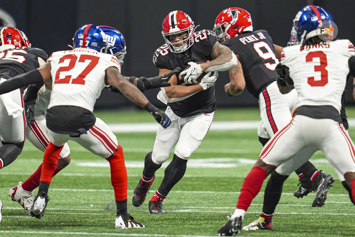 Dec 22, 2024; Atlanta, Georgia, USA; Atlanta Falcons running back Tyler Allgeier (25) runs with the ball against the New York Giants during the second half at Mercedes-Benz Stadium. Credit: Dale Zanine-Imagn Images