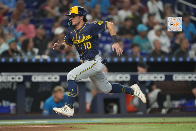 Jul 6, 2025; Miami, Florida, USA; Milwaukee Brewers right fielder Sal Frelick (10) scores on a sacrifice fly in the eighth inning against the Miami Marlins at loanDepot Park. Credit: Jim Rassol-Imagn Images