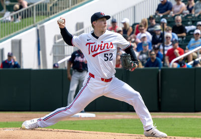 Feb 22, 2025; Fort Myers, Florida, USA; Minnesota Twins pitcher Zebby Matthews (52) pitching during the first inning of their game against the Atlanta Braves at Lee Health Sports Complex. Mandatory Credit: Chris Tilley-Imagn Images
