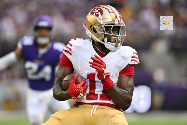 Sep 15, 2024; Minneapolis, Minnesota, USA; San Francisco 49ers wide receiver Brandon Aiyuk (11) looks for yards after the catch against the Minnesota Vikings during the first quarter U.S. Bank Stadium. Credit: Jeffrey Becker-Imagn Images