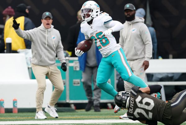 Dec 7, 2025; East Rutherford, New Jersey, USA; New York Jets safety Isaiah Oliver (26) tackles Miami Dolphins running back De'Von Achane (28) during the first half at MetLife Stadium. Mandatory Credit: Vincent Carchietta-Imagn Images