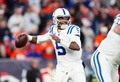 Dec 15, 2024; Denver, Colorado, USA; Indianapolis Colts quarterback Anthony Richardson (5) prepares to pass the ball in the second half against the Denver Broncos at Empower Field at Mile High. Mandatory Credit: Ron Chenoy-Imagn Images