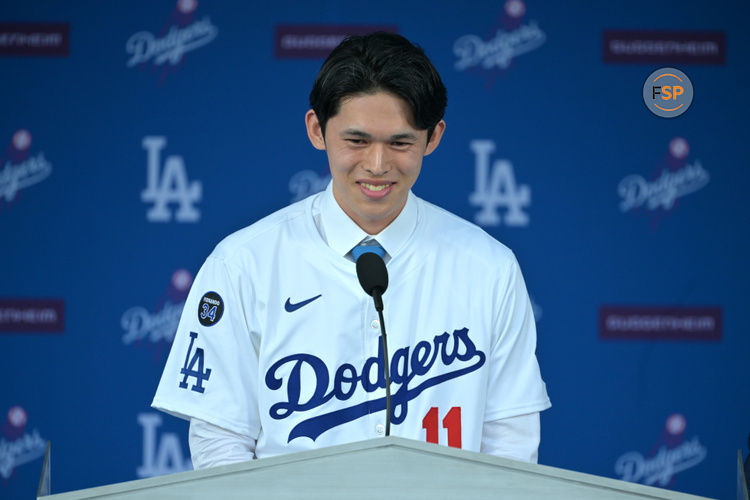 Jan 22, 2025; Los Angeles, CA, USA;  Los Angele Dodgers pitcher Roki Sasaki (11) speaks during an introductory press conference at Dodger Stadium. Credit: Jayne Kamin-Oncea-Imagn Images  