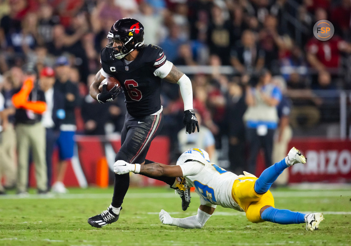 Oct 21, 2024; Glendale, Arizona, USA; Arizona Cardinals running back James Conner (6) against Los Angeles Chargers cornerback Tarheeb Still (29) in the second half at State Farm Stadium. Credit: Mark J. Rebilas-Imagn Images