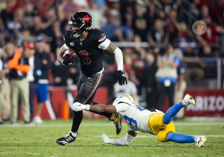 Oct 21, 2024; Glendale, Arizona, USA; Arizona Cardinals running back James Conner (6) against Los Angeles Chargers cornerback Tarheeb Still (29) in the second half at State Farm Stadium. Credit: Mark J. Rebilas-Imagn Images