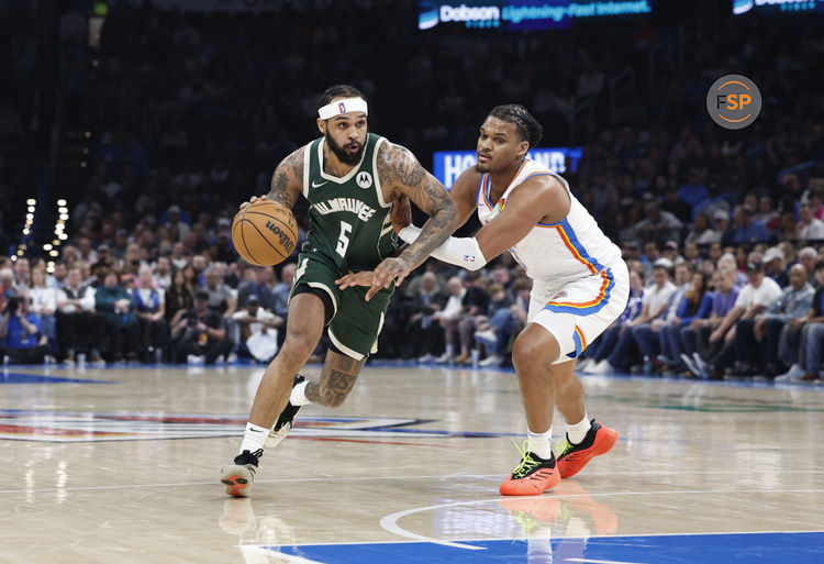 Feb 3, 2025; Oklahoma City, Oklahoma, USA; Milwaukee Bucks guard Gary Trent Jr. (5) drives to the basket as Oklahoma City Thunder forward Dillon Jones (3) defends during the second quarter at Paycom Center. Credit: Alonzo Adams-Imagn Images