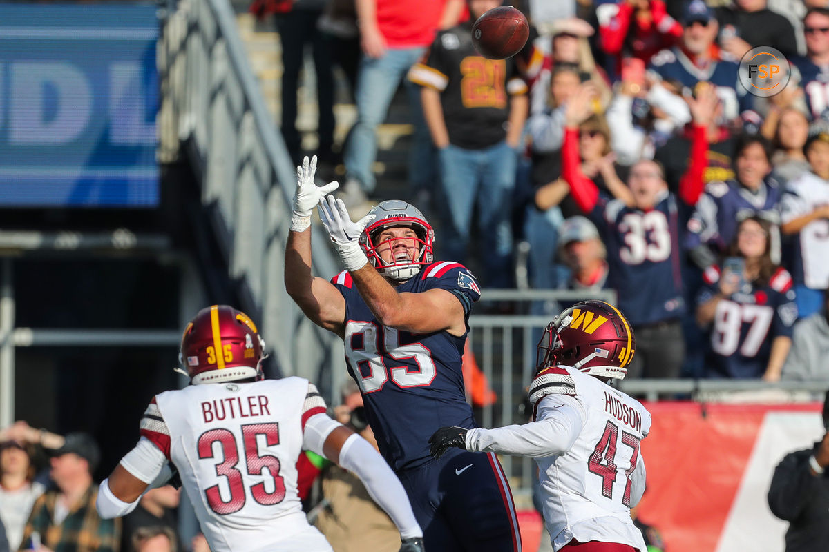 Nov 5, 2023; Foxborough, Massachusetts, USA; New England Patriots tight end Hunter Henry (85) catches a pass for a touchdown during the first half against the Washington Commanders at Gillette Stadium. Credit: Paul Rutherford-USA TODAY Sports