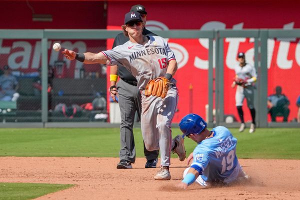 Sep 7, 2025; Kansas City, Missouri, USA; Minnesota Twins second baseman Luke Keaschall (15) gets the out on Kansas City Royals second baseman Michael Massey (19) at second base and throws to first during the seventh inning at Kauffman Stadium. Mandatory Credit: Denny Medley-Imagn Images