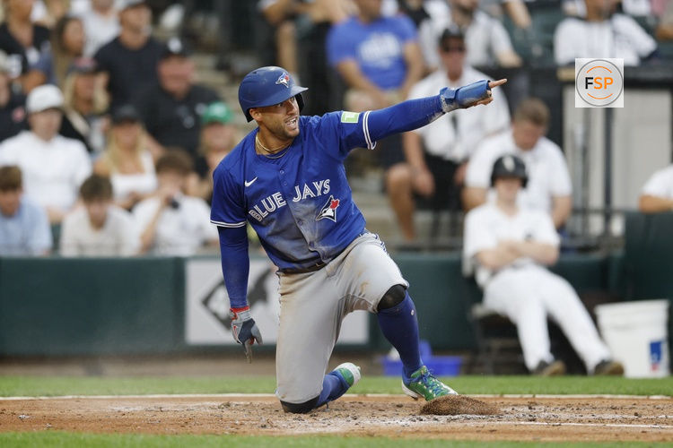 Jul 8, 2025; Chicago, Illinois, USA; Toronto Blue Jays designated hitter George Springer (4) reacts after scoring against the Chicago White Sox during the third inning at Rate Field. Credit: Kamil Krzaczynski-Imagn Images