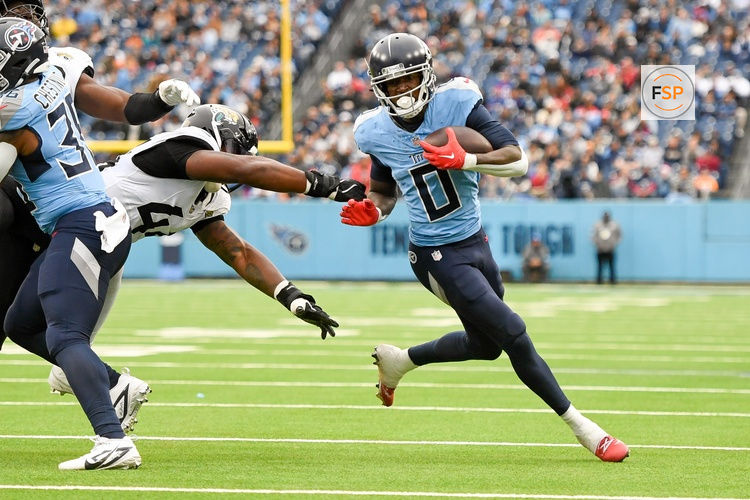 Dec 8, 2024; Nashville, Tennessee, USA;  Tennessee Titans wide receiver Calvin Ridley (0) runs the ball against the Jacksonville Jaguars during the first half at Nissan Stadium. Credit: Steve Roberts-Imagn Images