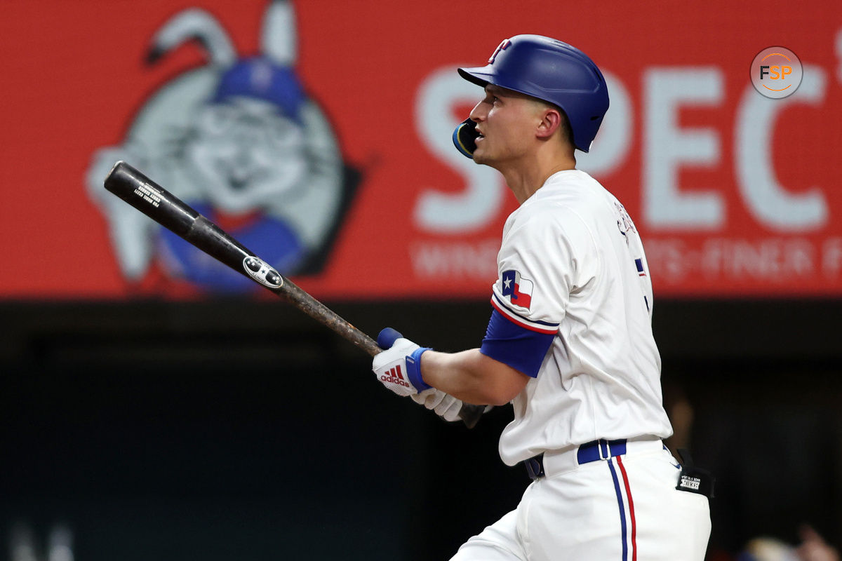 Aug 19, 2024; Arlington, Texas, USA; Texas Rangers shortstop Corey Seager (5) hits a home run against the Pittsburgh Pirates in the first inning at Globe Life Field. Credit: Tim Heitman-USA TODAY Sports