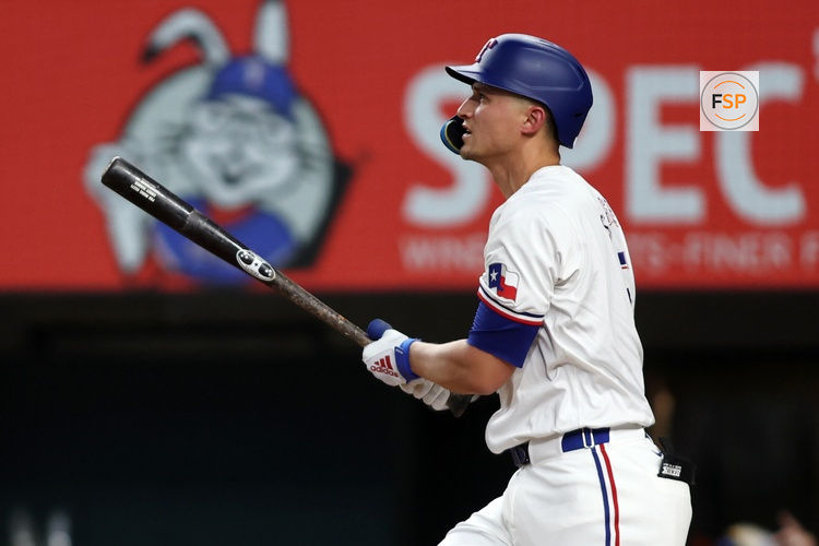 Aug 19, 2024; Arlington, Texas, USA; Texas Rangers shortstop Corey Seager (5) hits a home run against the Pittsburgh Pirates in the first inning at Globe Life Field. Credit: Tim Heitman-USA TODAY Sports