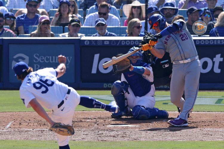 Oct 14, 2024; Los Angeles, California, USA; New York Mets first base Pete Alonso (20) hits a single against the Los Angeles Dodgers in the third inning during game two of the NLCS for the 2024 MLB Playoffs at Dodger Stadium. Credit: Jason Parkhurst-Imagn Images