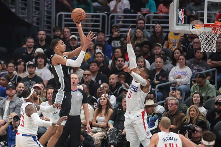 LOS ANGELES, CA - OCTOBER 29: San Antonio Spurs center Victor Wembanyama (1) shoots a jumper over LA Clippers guard Russell Westbrook (0) during the San Antonio Spurs game versus the Los Angeles Clippers on October 29, 2023, at Crypto.com Arena in Los Angeles, CA. (Photo by Jevone Moore/Icon Sportswire)