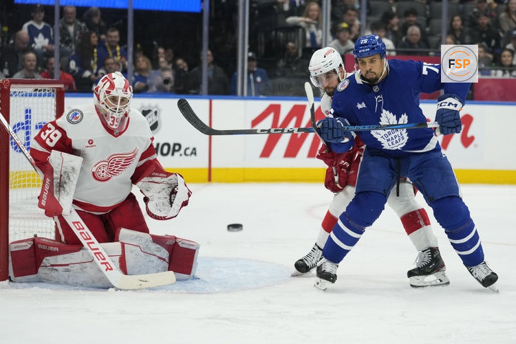 Nov 8, 2024; Toronto, Ontario, CAN; Toronto Maple Leafs forward Ryan Reaves (75) tries to deflect a puck against Detroit Red Wings goaltender Cam Talbot (39) during the third period at Scotiabank Arena. Credit: John E. Sokolowski-Imagn Images