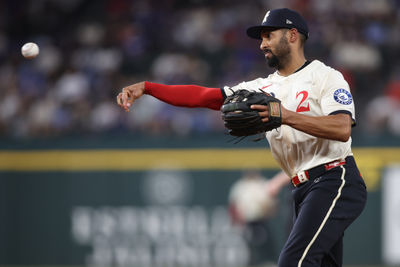 Apr 18, 2025; Arlington, Texas, USA; Texas Rangers second baseman Marcus Semien (2) throws to first during the fifth inning against the Los Angeles Dodgers at Globe Life Field. Mandatory Credit: Tim Heitman-Imagn Images