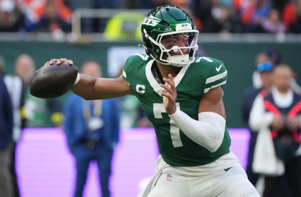 Oct 12, 2025; Tottenham, United Kingdom; New York Jets quarterback Justin Fields (7) throws a pass against the Denver Broncos during an NFL International Series game at Tottenham Hotspur Stadium. Mandatory Credit: Kirby Lee-Imagn Images