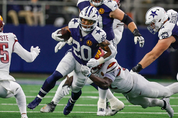 ARLINGTON, TX - NOVEMBER 23: Dallas Cowboys running back Tony Pollard (20) runs through the line of scrimmage during the game between the Dallas Cowboys and the Washington Commanders on November 23, 2023 at AT&T Stadium in Arlington, Texas. (Photo by Matthew Pearce/Icon Sportswire)