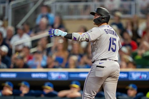 Jun 26, 2026; Minneapolis, Minnesota, USA; Colorado Rockies catcher Hunter Goodman (15) looks on as he hits a two run home run against the Minnesota Twins in the ninth inning at Target Field. Mandatory Credit: Jesse Johnson-Imagn Images