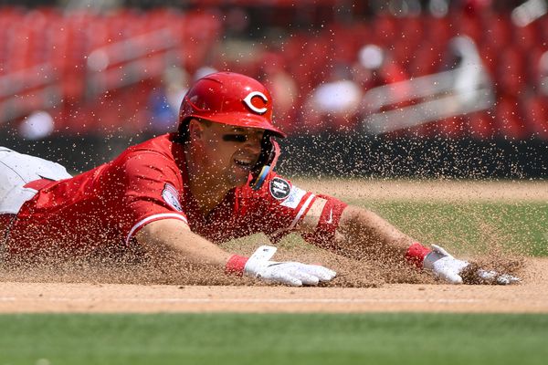 Jun 21, 2025; St. Louis, Missouri, USA;  Cincinnati Reds first baseman Spencer Steer (7) slides in at third base after hitting a triple against the St. Louis Cardinals during the eighth inning at Busch Stadium. Mandatory Credit: Jeff Curry-Imagn Images
