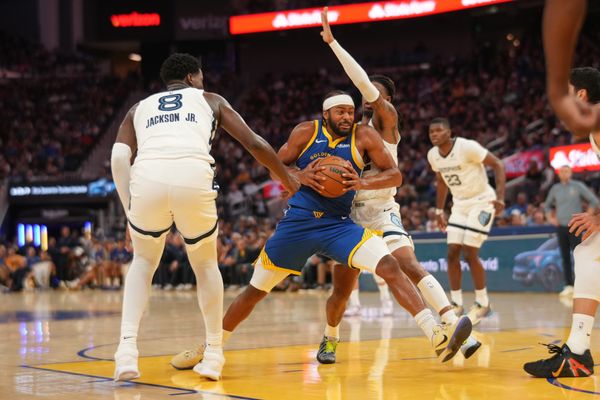 Oct 27, 2025; San Francisco, California, USA; Golden State Warriors guard Moses Moody (4) drives to the hoop between Memphis Grizzlies forward Jaren Jackson Jr. (8) and guard Ja Morant (12) in the third quarter at the Chase Center. Mandatory Credit: Cary Edmondson-Imagn Images