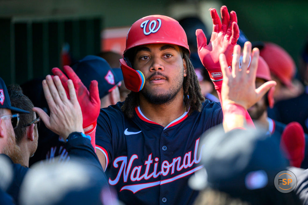 JUPITER, FL - FEBRUARY 25: Washington Nationals  outfielder James Wood (50) celebrates scoring a home run with teammates in the dugout during an MLB spring training game between the Washington Nationals and the Miami Marlins at the Roger Dean Chevrolet Stadium on February 25, 2024 in Jupiter, Florida. (Photo by Doug Murray/Icon Sportswire)
