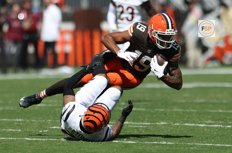 Sep 7, 2025; Cleveland, Ohio, USA; Cleveland Browns wide receiver Cedric Tillman (19) is tackled by Cincinnati Bengals safety Geno Stone (22) during the second half at Huntington Bank Field. Credit: Scott Galvin-Imagn Images
