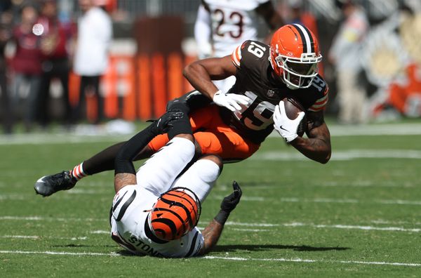 Sep 7, 2025; Cleveland, Ohio, USA; Cleveland Browns wide receiver Cedric Tillman (19) is tackled by Cincinnati Bengals safety Geno Stone (22) during the second half at Huntington Bank Field. Mandatory Credit: Scott Galvin-Imagn Images