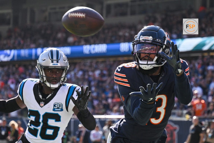 Oct 6, 2024; Chicago, Illinois, USA; Chicago Bears wide receiver Keenan Allen (13) attempts a catch as Carolina Panthers cornerback Chau Smith-Wade (26) defends during the fourth quarter at Soldier Field. Credit: Daniel Bartel-Imagn Images