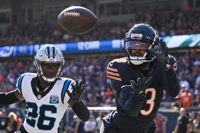 Oct 6, 2024; Chicago, Illinois, USA; Chicago Bears wide receiver Keenan Allen (13) attempts a catch as Carolina Panthers cornerback Chau Smith-Wade (26) defends during the fourth quarter at Soldier Field. Mandatory Credit: Daniel Bartel-Imagn Images