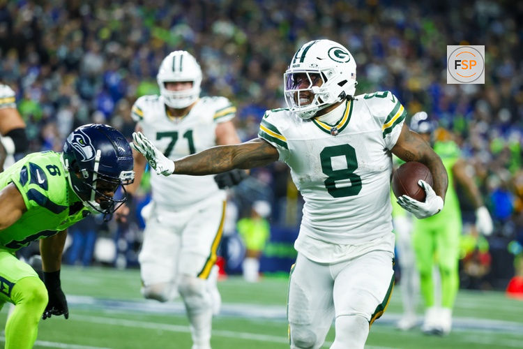 Dec 15, 2024; Seattle, Washington, USA; Green Bay Packers running back Josh Jacobs (8) rushes against the Seattle Seahawks during the first quarter at Lumen Field. Credit: Joe Nicholson-Imagn Images