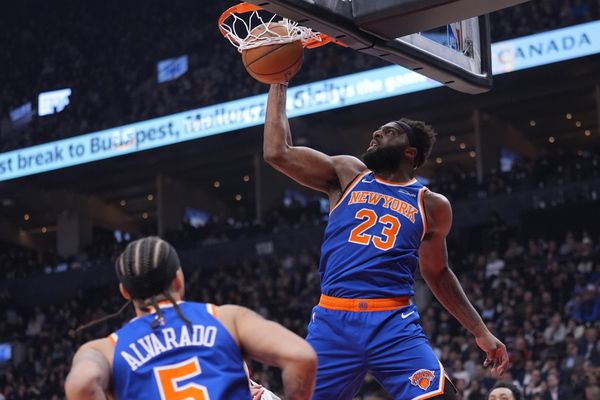 Mar 3, 2026; Toronto, Ontario, CAN; New York Knicks center Mitchell Robinson (23) shoots against the Toronto Raptors during the first half at Scotiabank Arena. Mandatory Credit: John E. Sokolowski-Imagn Images