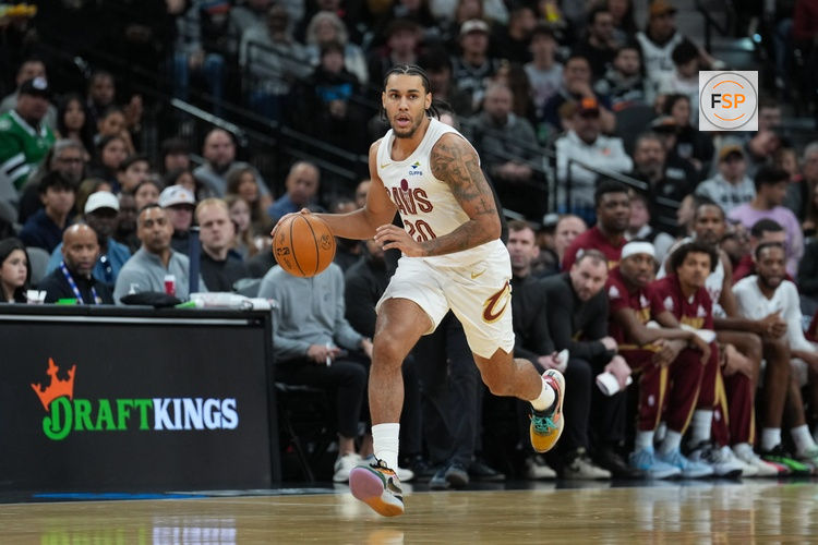 Dec 29, 2025; San Antonio, Texas, USA;  Cleveland Cavaliers guard Jaylon Tyson (20) dribbles in the first half against the San Antonio Spurs at Frost Bank Center. Credit: Daniel Dunn-Imagn Images