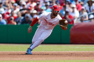 Mar 9, 2025; Clearwater, Florida, USA; Philadelphia Phillies first baseman Bryce Harper (3) fields the ball against the Baltimore Orioles in the fifth inning during spring trining at BayCare Ballpark. Mandatory Credit: Nathan Ray Seebeck-Imagn Images