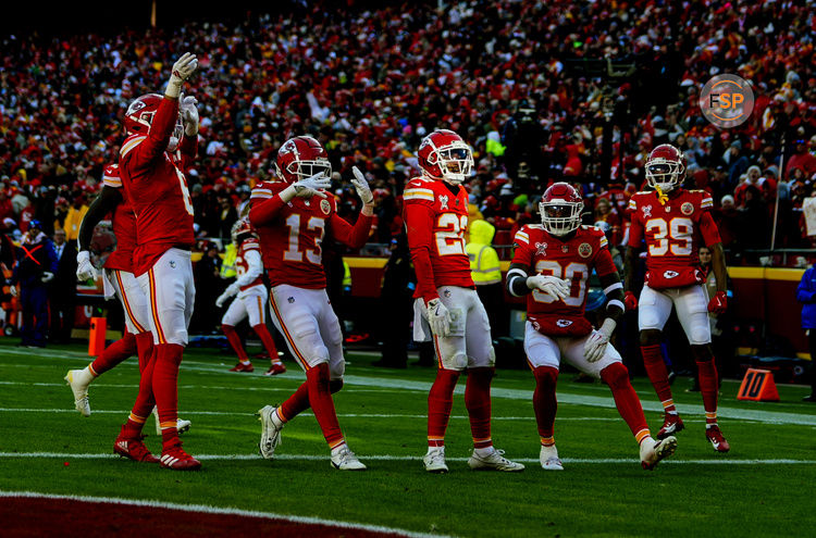 Dec 21, 2024; Kansas City, Missouri, USA; Kansas City Chiefs cornerback Trent McDuffie (22) celebrates with teammates after an interception during the first half against the Houston Texans at GEHA Field at Arrowhead Stadium. Credit: Jay Biggerstaff-Imagn Images