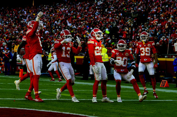 Dec 21, 2024; Kansas City, Missouri, USA; Kansas City Chiefs cornerback Trent McDuffie (22) celebrates with teammates after an interception during the first half against the Houston Texans at GEHA Field at Arrowhead Stadium. Mandatory Credit: Jay Biggerstaff-Imagn Images