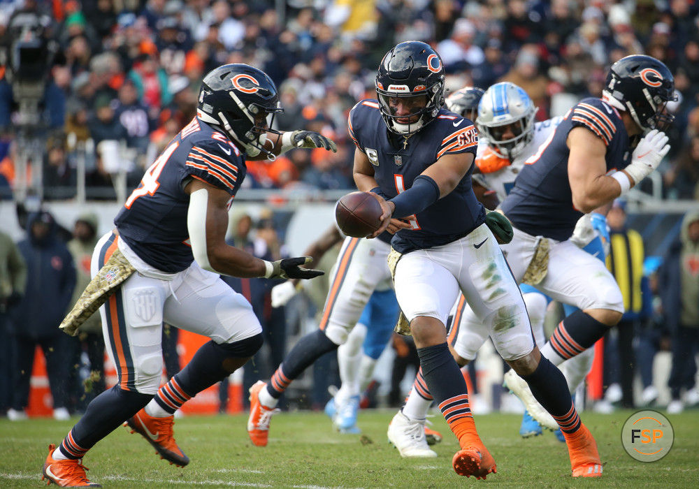 CHICAGO, IL - NOVEMBER 13: Chicago Bears quarterback Justin Fields (1) hands the ball off to Chicago Bears running back Khalil Herbert (24) during a game between the Detroit Lions and the Chicago Bears on November 13, 2022 at Soldier Field in Chicago, IL. (Photo by Melissa Tamez/Icon Sportswire)