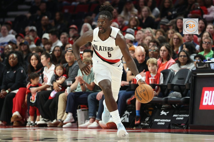 Oct 7, 2026; Portland, Oregon, USA;  Portland Trail Blazers guard Jrue Holiday (5) brings the ball up the court against the Golden State Warriors during the first half at Moda Center.  Credit: Jaime Valdez-Imagn Images