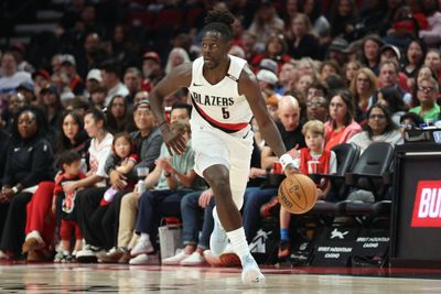 Oct 7, 2026; Portland, Oregon, USA;  Portland Trail Blazers guard Jrue Holiday (5) brings the ball up the court against the Golden State Warriors during the first half at Moda Center.  Mandatory Credit: Jaime Valdez-Imagn Images