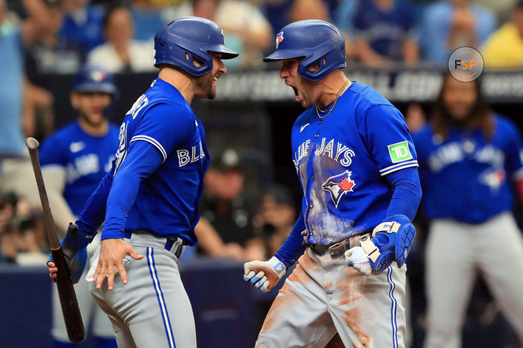 ST. PETERSBURG, FL - September 24: Toronto Blue Jays Outfielder Kevin Kiermaier (39) celebrates with Right fielder George Springer (4) on Springer's inside-the-park home run during the MLB regular season game between the Toronto Blue Jays and the Tampa Bay Rays on September 24, 2023, at Tropicana Field in St. Petersburg, FL. (Photo by Cliff Welch/Icon Sportswire)