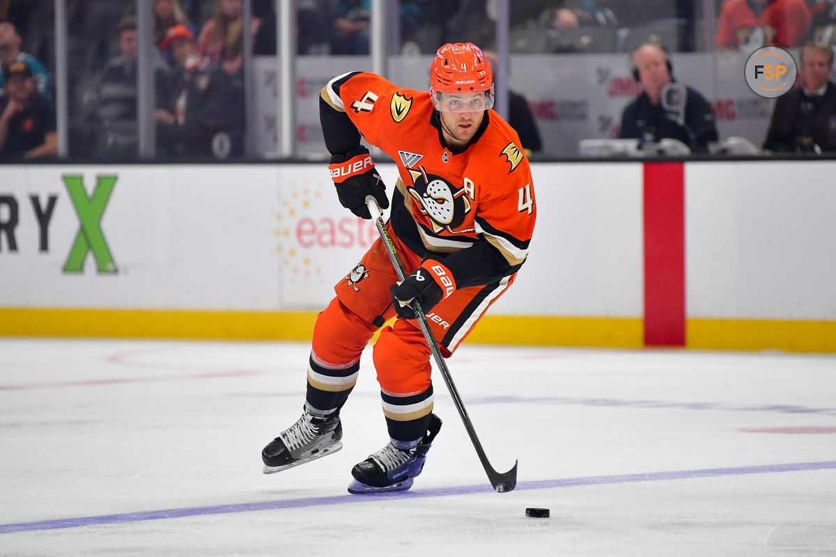 Oct 22, 2024; Anaheim, California, USA; Anaheim Ducks defenseman Cam Fowler (4) controls the puck against the San Jose Sharks  during the second period at Honda Center. Credit: Gary A. Vasquez-Imagn Images