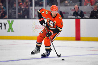 Oct 22, 2024; Anaheim, California, USA; Anaheim Ducks defenseman Cam Fowler (4) controls the puck against the San Jose Sharks  during the second period at Honda Center. Mandatory Credit: Gary A. Vasquez-Imagn Images