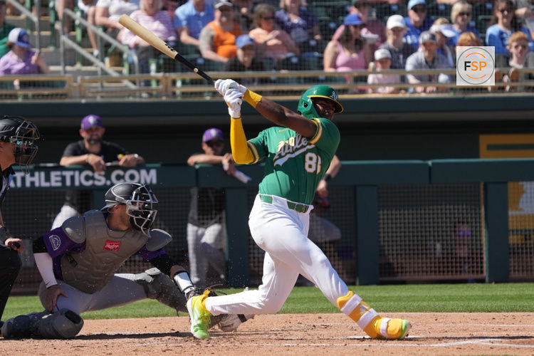 Mar 6, 2026; Mesa, Arizona, USA; Athletics shortstop Leo de Vries (83) hits against the Colorado Rockies in the second inning at Hohokam Stadium. Credit: Rick Scuteri-Imagn Images