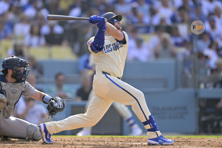 May 31, 2025; Los Angeles, California, USA; Los Angeles Dodgers third baseman Max Muncy (13) hits a three run home run against the New York Yankees in the second inning at Dodger Stadium. Credit: Jayne Kamin-Oncea-Imagn Images