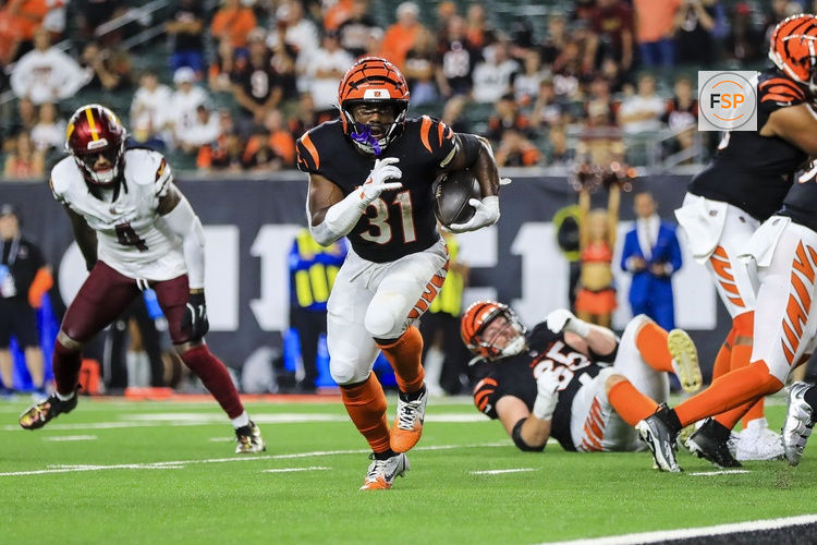 Sep 23, 2024; Cincinnati, Ohio, USA; Cincinnati Bengals running back Zack Moss (31) runs with the ball for a touchdown against the Washington Commanders in the second half at Paycor Stadium. Credit: Katie Stratman-Imagn Images