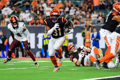 Sep 23, 2024; Cincinnati, Ohio, USA; Cincinnati Bengals running back Zack Moss (31) runs with the ball for a touchdown against the Washington Commanders in the second half at Paycor Stadium. Mandatory Credit: Katie Stratman-Imagn Images